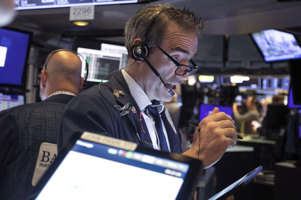 Trader Gregory Rowe works on the floor of the New York Stock Exchange, Tuesday, June 11, 2019. Stocks are rising early Tuesday as Wall Street continues to thrive in June. (AP Photo/Richard Drew)