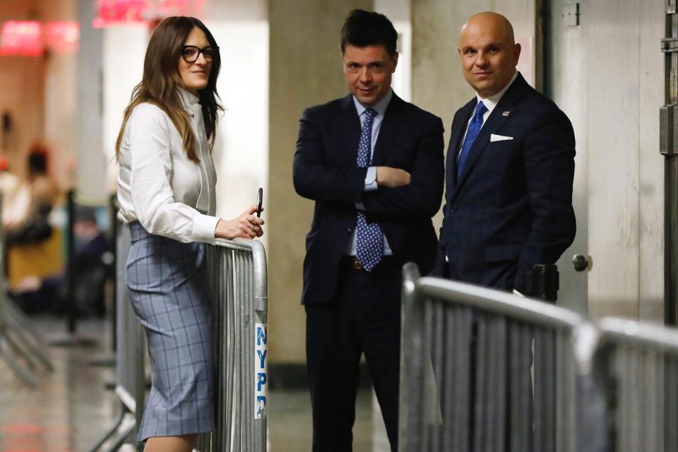 Harvey Weinstein's defense team, Donna Rotunno, Damon Cheronis and Arthur Aidala, huddle in the hallway during jury deliberations in Weinstein's sex-crimes trial in New York on Feb. 21, 2020.