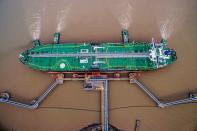 Oil tanker unloads crude oil at a crude oil terminal in Zhoushan