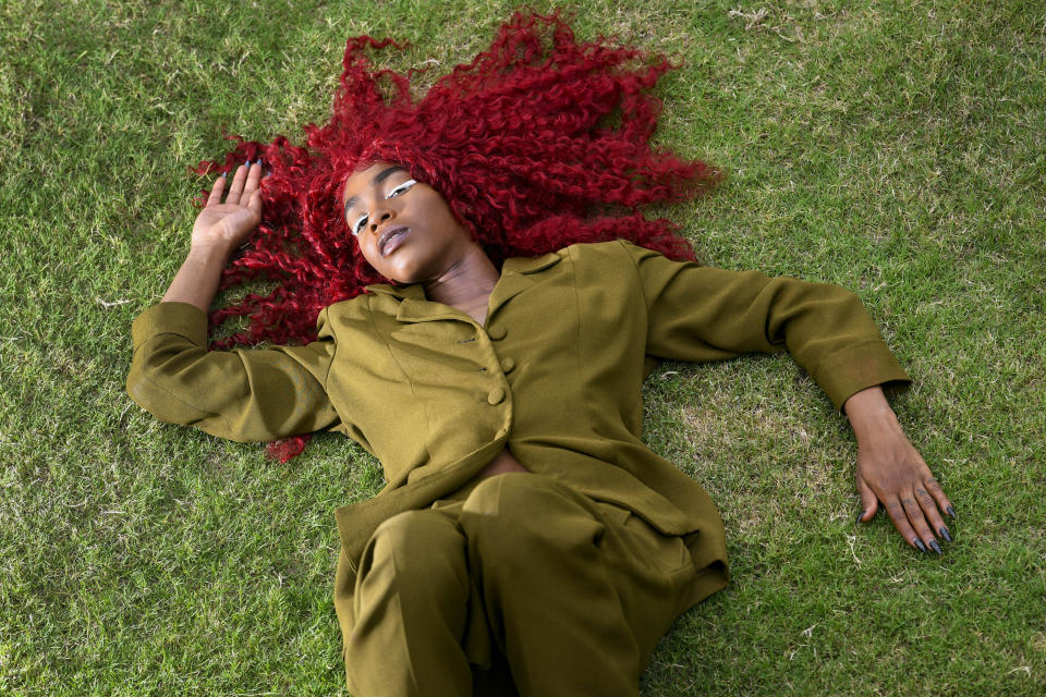 This Aug. 19, 2019 photo shows music artist Buku Abi, born Joann Kelly, posing in Atlanta. As the daughter of R. Kelly, she experienced her fair share of hardships. She is no longer in touch with him and says being R. Kelly’s daughter is like “a double-edged sword.” In March, Abi released her debut EP “Don’t Call Me” and she appeared on the WEtv reality series, “Growing Up Hip Hop: Atlanta.” (AP Photo/John Amis)