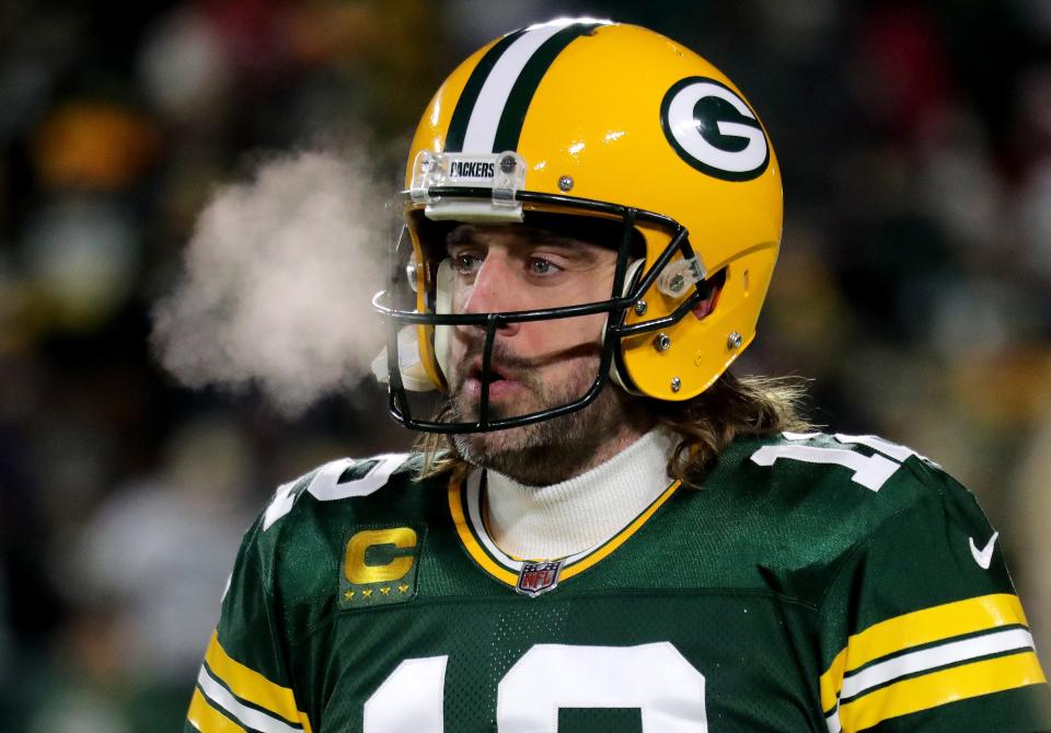 Green Bay Packers quarterback Aaron Rodgers (12) warms up before the Green Bay Packers divisional playoff game against the San Francisco 49ers at Lambeau Field.