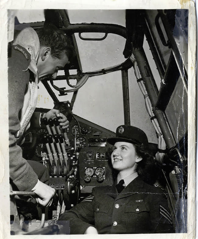 <span>Public Relations photo of Moire Fee and Flight Lieutenant Cote taken in the interior of one of the 6 Group Bombers in 1944. The photo was meant to appear in a Canadian newspaper but was rejected by the censor because it shows the plane's control panel. Photo courtesy of <a href="http://www.thememoryproject.com/stories/1749:moire-fee/" rel="nofollow noopener" target="_blank" data-ylk="slk:Historica-Dominion Institute;elm:context_link;itc:0;sec:content-canvas" class="link ">Historica-Dominion Institute</a>.</span>