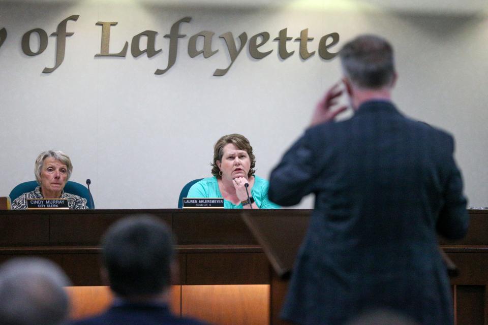 Cindy Murray, Lafayette City Clerk, and Lauren Ahlersmeyer, Lafayette City Councilwoman, listen to Chris Wischer, the attorney for the Town of Dayton explain why the board should vote no on the voluntary annexation of the Carr family property into the City of Lafayette, at May's Lafayette City Council meeting, on Monday, May 1, 2023, in Lafayette, Ind.