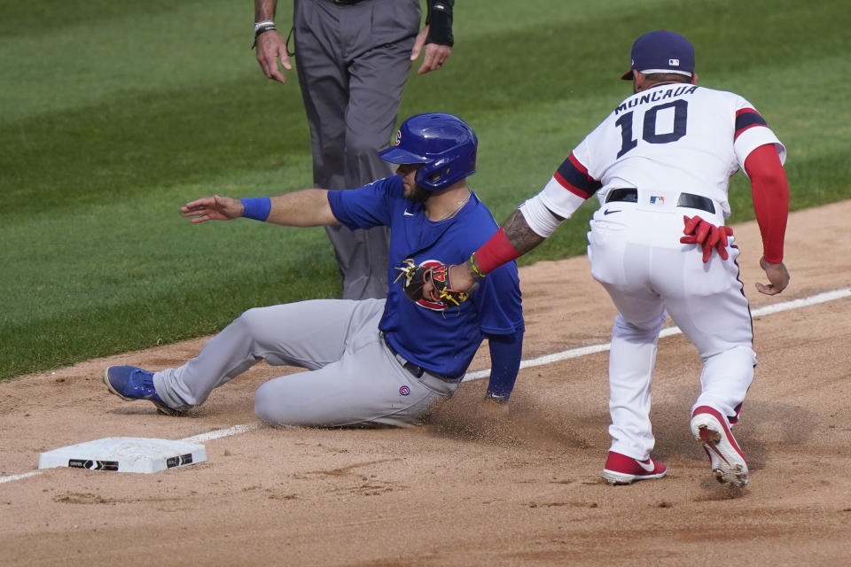 Chicago White Sox third baseman Yoan Moncada, right, tags out Chicago Cubs' David Bote at third during the sixth inning of a baseball game in Chicago, Sunday, Sept. 27, 2020. (AP Photo/Nam Y. Huh)