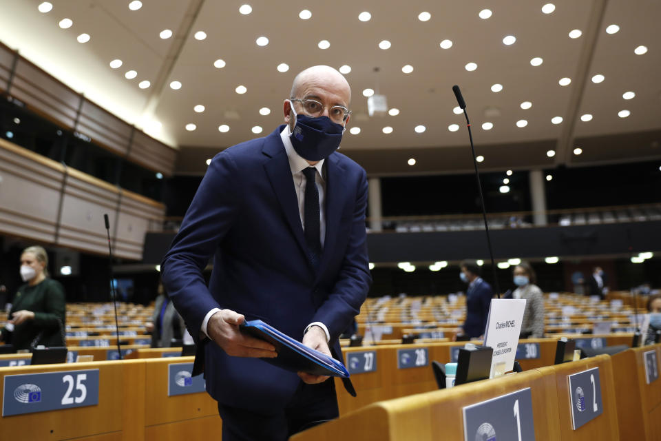 European Council President Charles Michel arrives to the main chamber for a plenary session on the inauguration of the new President of the United States and the current political situation, at the European Parliament in Brussels, Wednesday, Jan. 20, 2021. (AP Photo/Francisco Seco, Pool)