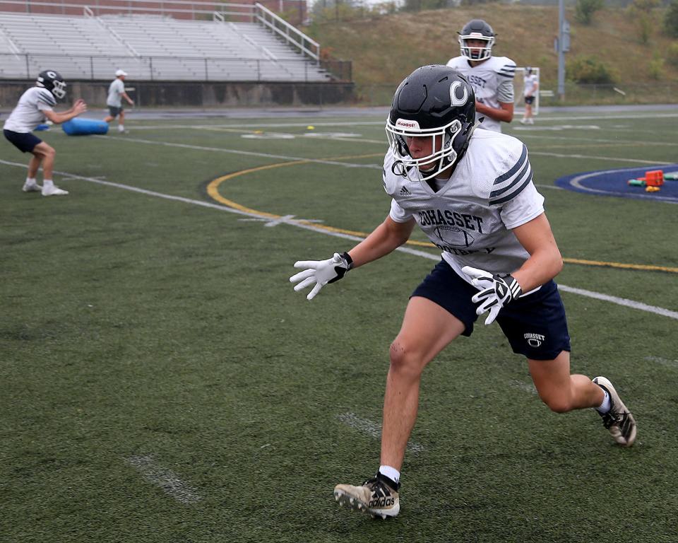 Cohasset junior Declan Lee gets in position upfield after making the initial block in an offensive line/ linebacker drill during football practice at Cohasset High School on Tuesday, Aug. 23, 2022.