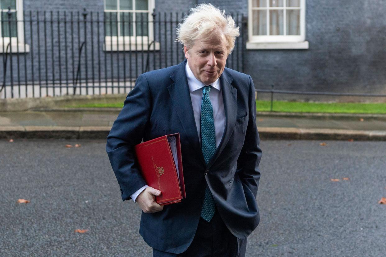 201215 -- LONDON, Dec. 15, 2020 -- British Prime Minister Boris Johnson leaves 10 Downing Street to attend a cabinet meeting in London, Britain, on Dec. 15, 2020. London will move into Tier Three, the highest level in England s local coronavirus restriction tier system, from midnight on Wednesday, British Health Secretary Matt Hancock said Monday. Photo by /Xinhua BRITAIN-LONDON-COVID-19-TIER THREE RayxTang PUBLICATIONxNOTxINxCHN