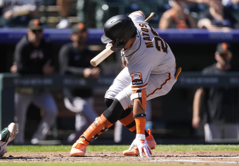 San Francisco Giants' Luis Matos reacts after getting hit by a pitch from Colorado Rockies starting pitcher Brent Suter during the second inning in the first baseball game of a doubleheader, Saturday, Sept. 16, 2023. (AP Photo/David Zalubowski)