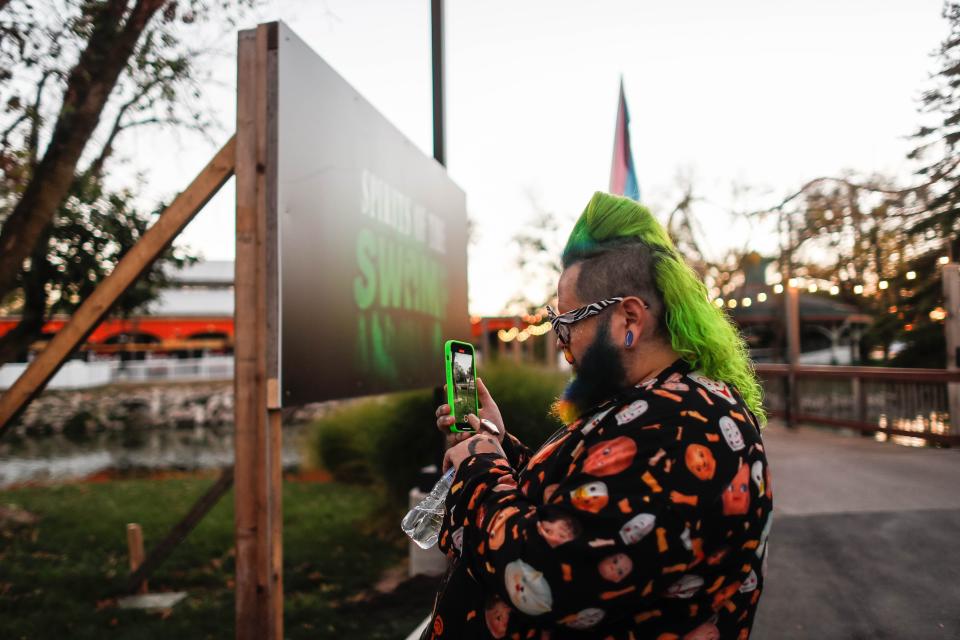 Andrew Fuller of Sugar Freakshow and the Netflix series "Is It Cake?" takes a photo of one of Adventureland Park’s Phantom Fall Fest attractions in Altoona. Phantom Fall Fest features haunted houses, seasonal foods, scare zones, and rides after dark.