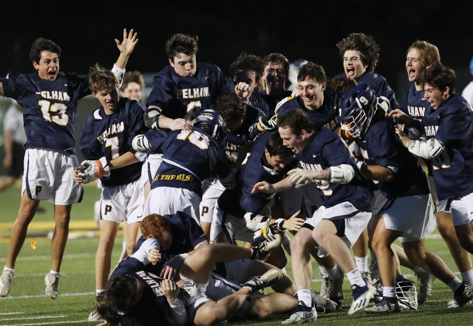 Pelham players celebrate their 14-6 victory over Pearl River  in the boys lacrosse Section 1 Class B championship game at Lakeland High School in Shrub Oak May 26, 2022. 