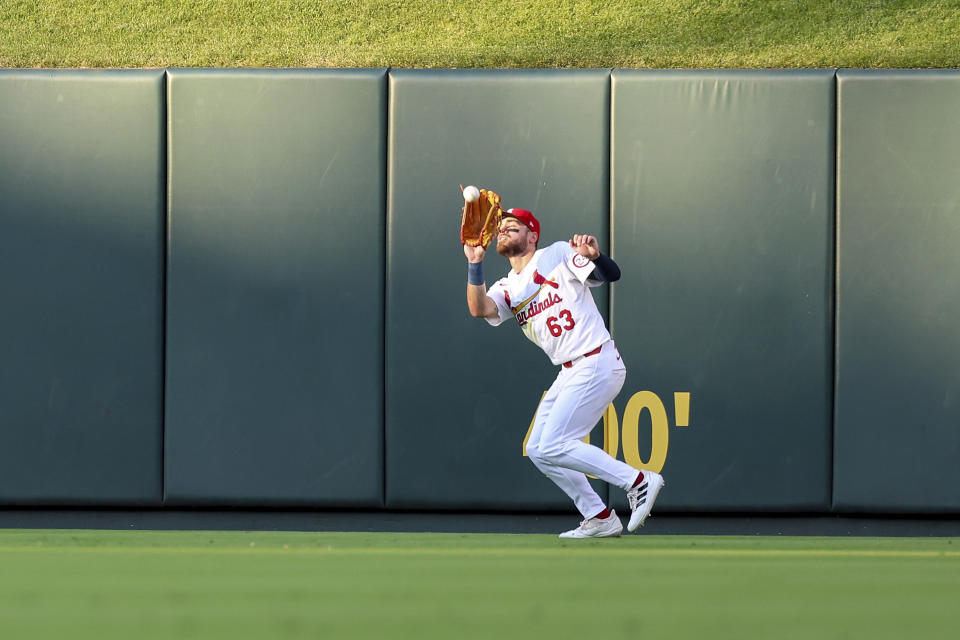 St. Louis Cardinals center fielder Michael Siani catches a fly ball for an out against Atlanta Braves' Ramon Laureano during the third inning of a baseball game Monday, June 24, 2024, in St. Louis. (AP Photo/Scott Kane)