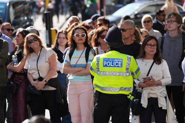 Members of the public wait outside St Paul’s Cathedral, ahead of the arrival of the Duke of Sussex