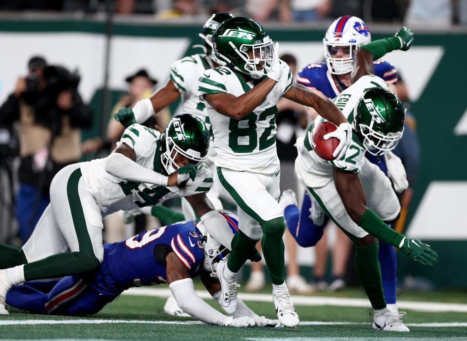 EAST RUTHERFORD, NEW JERSEY - SEPTEMBER 11: Wide receiver Xavier Gipson #82 of the New York Jets scores the game winning touchdown on a 65-yard punt return during the overtime quarter of the NFL game against the Buffalo Bills at MetLife Stadium on September 11, 2023 in East Rutherford, New Jersey. The Jets defeated the Bills 22-16 in overtime. (Photo by Elsa/Getty Images) ORG XMIT: 775992265 ORIG FILE ID: 1675304562