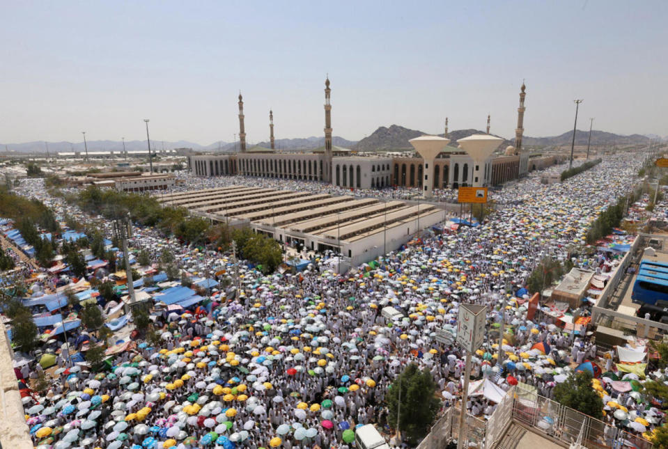 Muslim pilgrims leave after they finished their prayers at Namira Mosque in Arafat