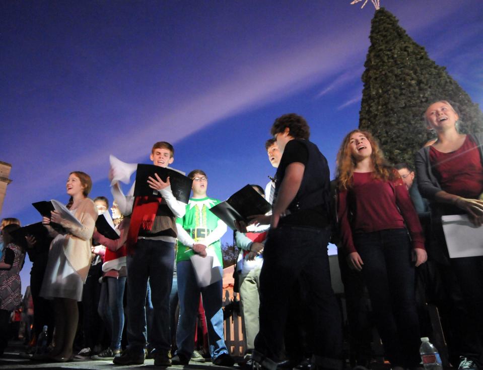 Singers with Thalian Association and One Christian Network sing holiday songs prior to Wilmington's tree lighting at the base of Princess St. in downtown Wilmington.