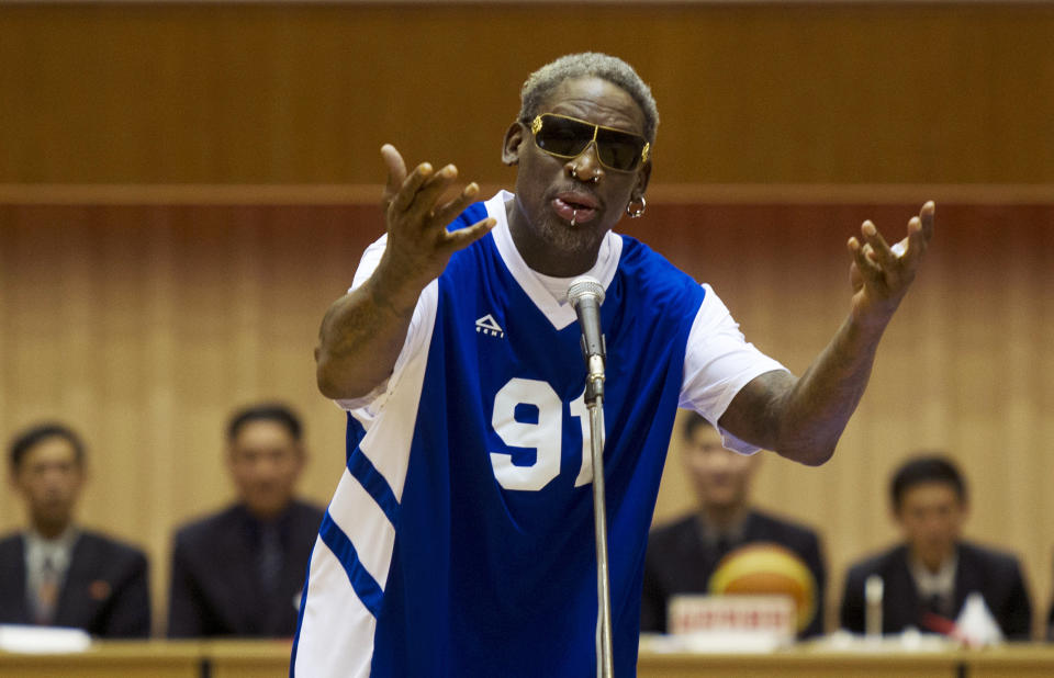 FILE - In this Jan. 8, 2014 file photo, former NBA star Dennis Rodman sings "Happy Birthday" to North Korean leader Kim Jong Un, seated above in the stands, before an exhibition basketball game at an indoor stadium in Pyongyang, North Korea. (AP Photo/Kim Kwang Hyon, File)