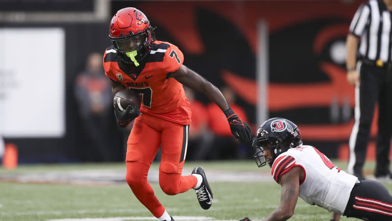 Oregon State wide receiver Silas Bolden (7) dodges Utah cornerback JaTravis Broughton (4) during the first half of an NCAA college football game Friday, Sept. 29, 2023, in Corvallis, Ore.
