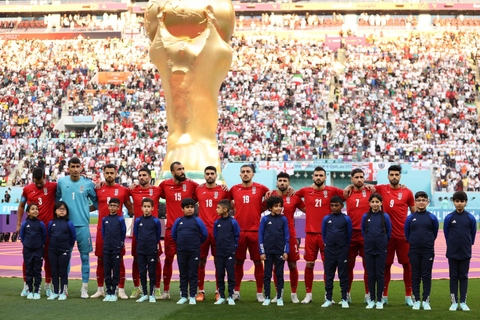 Iran players line up for the national anthem prior to the FIFA World Cup Qatar 2022 Group B match between England and IR Iran at Khalifa International Stadium. / Credit: Julian Finney / Getty Images