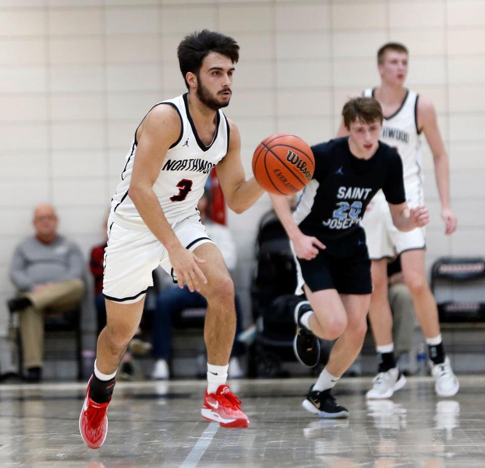 NorthWood senior Keegin Stats dribbles with the ball up the court during a boys basketball game against South Bend Saint Joseph Tuesday, Jan. 16, 2024, at NorthWood High School in Nappanee.