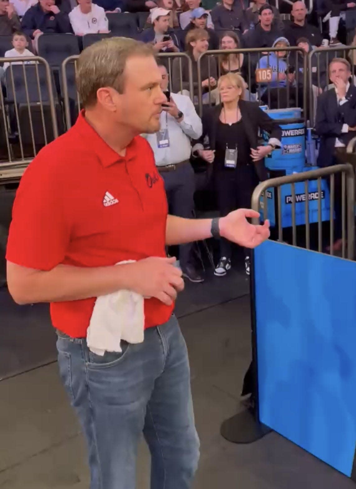 FAU football coach Tom Herman plays the air guitar at Madison Square Garden after the basketball team defeated Kansas State in the Elite Eight.