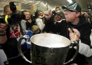 Saskatchewan Premier Brad Wall drinks from the Grey Cup after the Saskatchewan Roughriders defeated the Hamilton Tiger-Cats in the CFL's 101st Grey Cup championship football game in Regina, Saskatchewan November 24, 2013. REUTERS/Mark Blinch (CANADA - Tags: SPORT FOOTBALL)