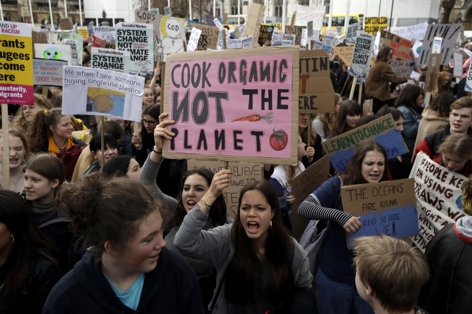 Youngsters take part in a student climate protest in Parliament Square in London, Friday, March 15, 2019. Students in more than 80 countries and territories worldwide plan to skip class Friday in protest over their governments' failure to act against global warming. The coordinated 'school strike' was inspired by 16-year-old activist Greta Thunberg, who began holding solitary demonstrations outside the Swedish parliament last year. (AP Photo/Matt Dunham)