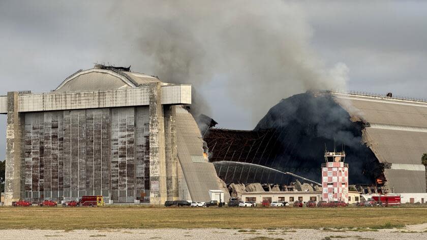 TUSTIN CA NOVEMBER 7, 2023 - A massive fire continues to burn the historic north blimp hangar in Tustin, an Orange County landmark that dates back to World War II on Tuesday morning, Nov. 7, 2023. (Irfan Khan / Los Angeles Times)