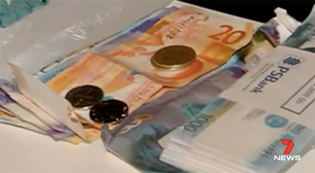 The money confiscated in the investigation. Source: 7News