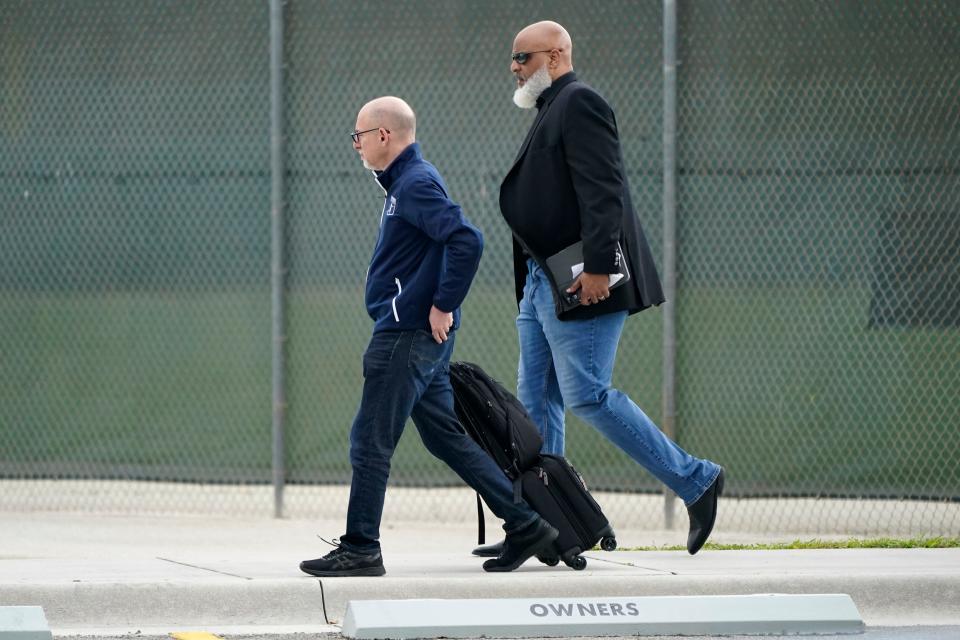 Bruce Meyer, chief union negotiator, left, and Tony Clark, executive director of the players association, right, arrive at Roger Dean Stadium as negotiations continue toward a labor deal between Major League Baseball and the players' association, Tuesday, March 1, 2022, in Jupiter, Fla.