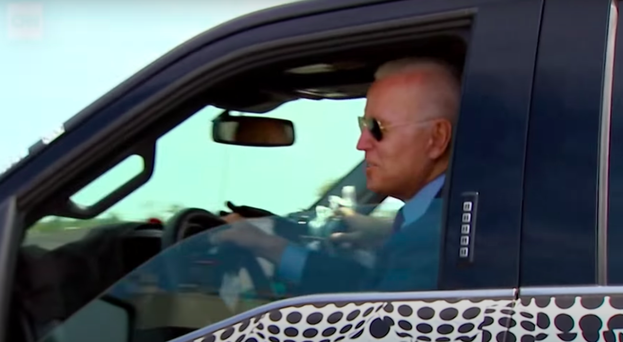 <p>President Joe Biden took the Ford electric truck for a quick spin but conspiracy theorists claimed that it was staged</p> (CNN/Screengrab)