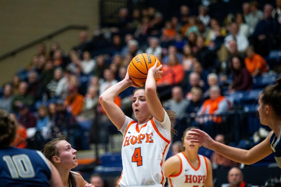 Hope's Claire Baguley passes to an open teammate during a game against conference rival Trine Saturday, Dec. 17, 2022, at DeVos Fieldhouse. 