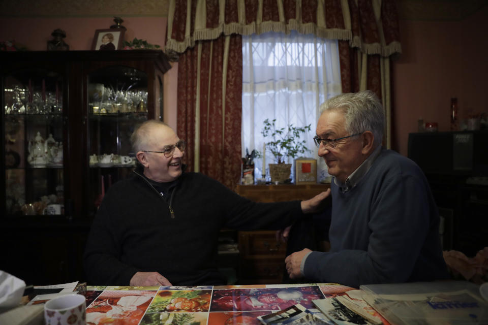 Former British Channel Tunnel worker Graham Fagg, left, and Former French Channel Tunnel worker Philippe Cozette sit together during an interview with The Associated Press at Graham's home in Dover, England, Thursday, Jan. 30, 2020. By digging their way to each other deep under the English Channel, tunnelers Graham Fagg and Philippe Cozette became symbols for British-French friendship when they made the first breakthrough in the Channel Tunnel nearly 30 years ago. (AP Photo/Matt Dunham)