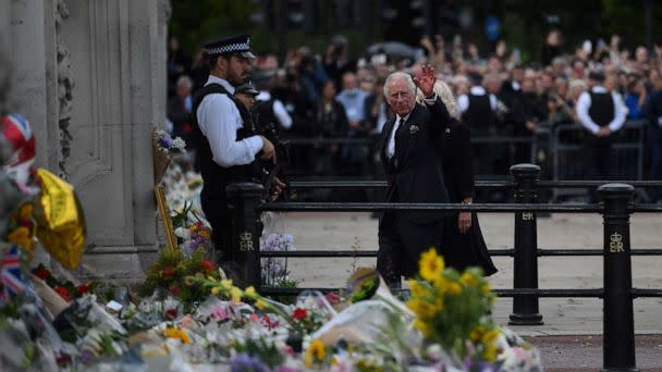 PHOTO: Britain's King Charles III and Britain's Camilla, Queen Consort greet the crowd upon their arrival Buckingham Palace in London, Sept. 9, 2022. (Daniel Leal/AFP via Getty Images)