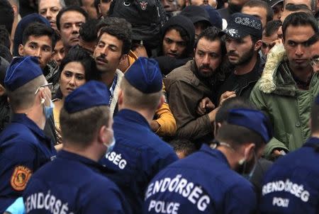 The police tries to maintain order at the Keleti station in Budapest, Hungary September 10, 2015. REUTERS/Bernadett Szabo