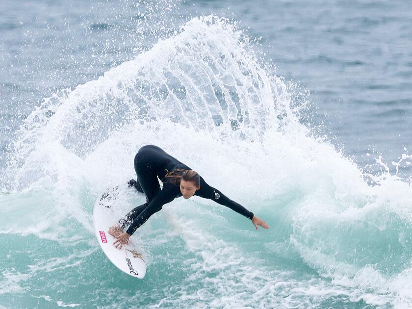 A surfer rides a wave at Lower Trestles offshore of San Clemente