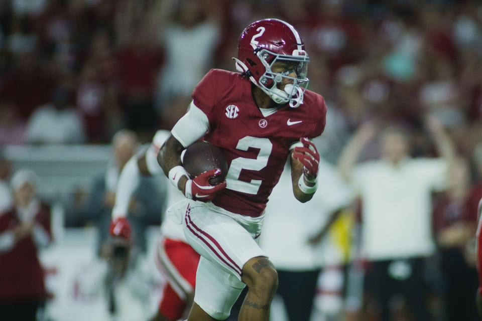 Aug 31, 2024; Tuscaloosa, Alabama, USA; Alabama Crimson Tide wide receiver Ryan Williams (2) carries the ball for a touchdown against the Western Kentucky Hilltoppers during the second quarter at Bryant-Denny Stadium. Mandatory Credit: Will McLelland-USA TODAY Sports