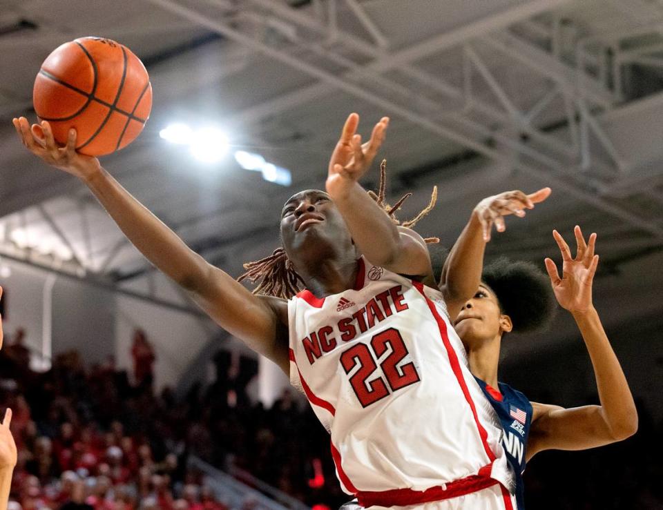 N.C. State’s Saniya Rivers drives to the basket past UConn’s Qadence Samuels during the second half of the Wolfpack’s 92-81 win on Sunday, Nov. 12, 2023, at Reynolds Coliseum in Raleigh, N.C.