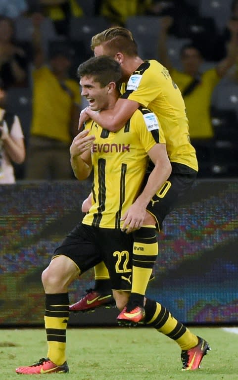 Borussia Dortmund's Christian Pulisic (L) celebrates with a teammate after scoring against Manchester City during the 2016 International Champions Cup football match