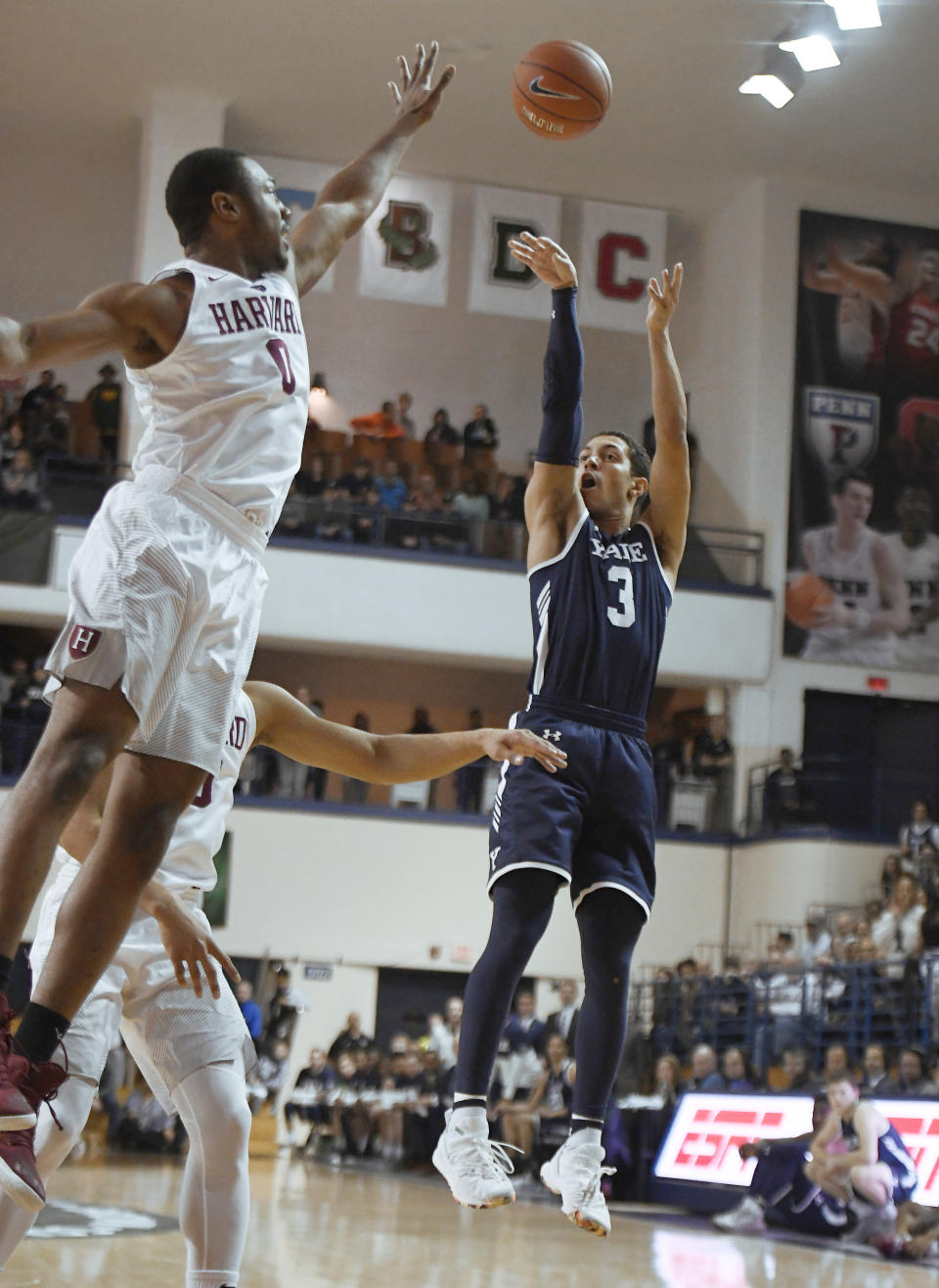 Yale's Alex Copeland (3) shoots over Harvard's Chris Lewis (0) during the first half of an NCAA college basketball game in Ivy League championship at Yale University in New Haven, Conn., Sunday, March 17, 2019, in New Haven, Conn. (AP Photo/Jessica Hill)