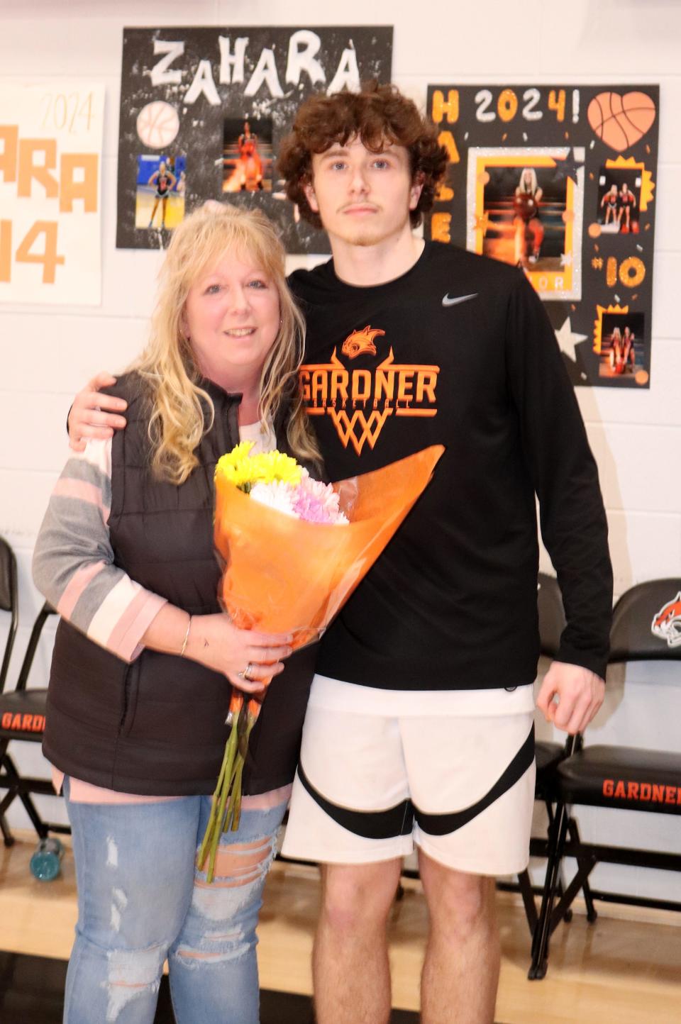 Melissa Corey poses with her son, Chris Woods, for Gardner's senior night on February 12, 2024.