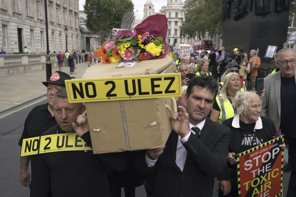 Protesters demonstrate outside the Downing Street to against the Ultra-Low Emission Zone (ULEZ) expansion, in London, Tuesday, Aug. 29, 2023. The ULEZ comes into effect. London's Labour mayor Khan is at odd with the Tory PM and his party over the restrictions. (AP Photo/Kin Cheung)