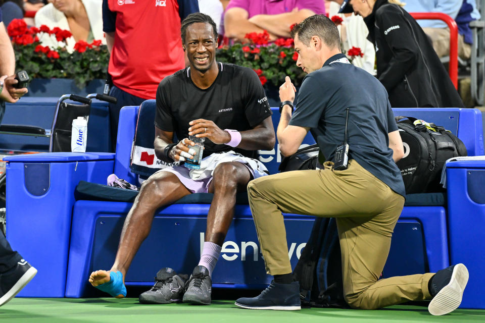 Gael Monfils in pain over a foot injury.