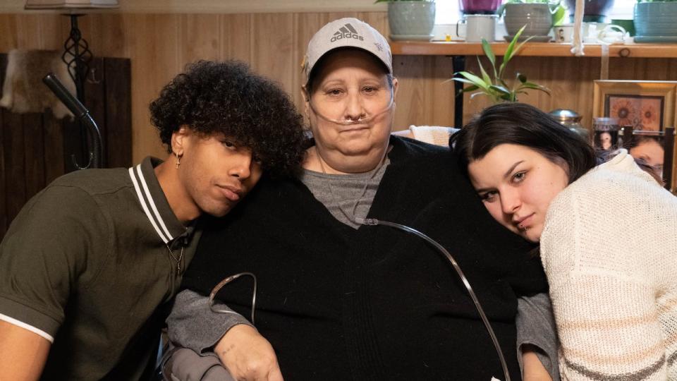 Carrie Boudreau, centre, with two of her grandchildren, Tyee and Tia Boudreau, at Carrie's home in Petawawa, Ont., on Dec. 7, 2023. Their mother was Carrie's daughter, Sommer Boudreau.