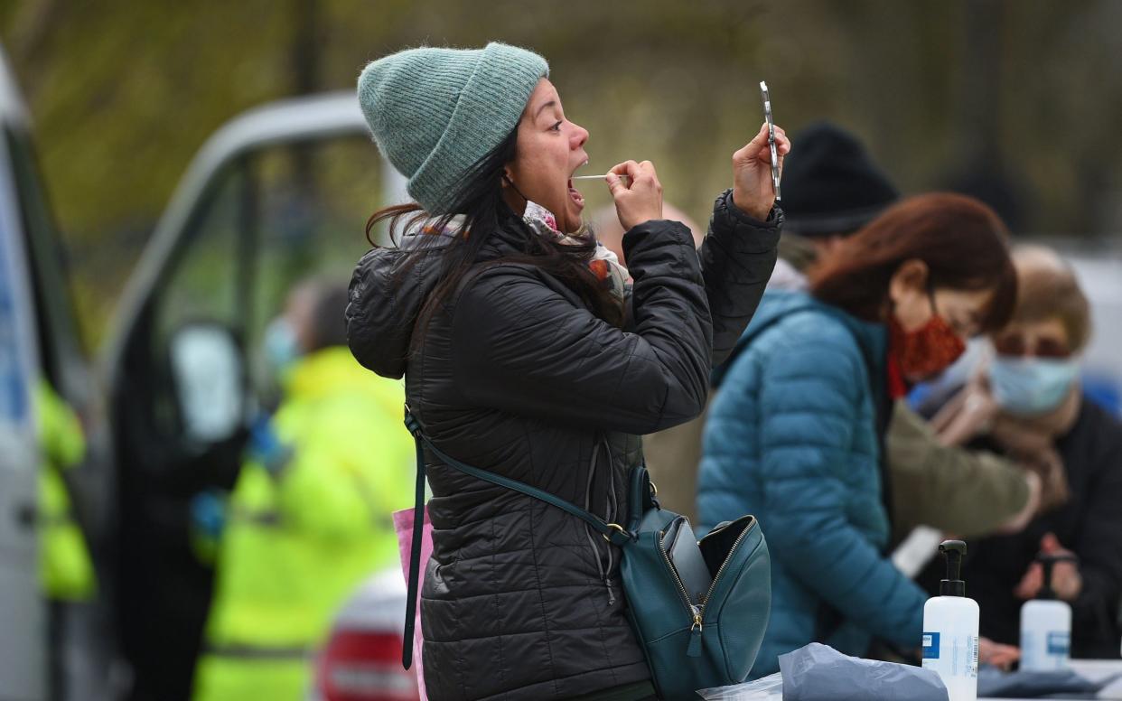 People take part in coronavirus surge testing on Clapham Common, south London - Kirsty O'Connor / PA