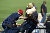 A security guard stops a fan of Portugal's Cristiano Ronaldo from disrupting the team training session in Campinas, June 12, 2014. Portugal is preparing for their first soccer match of the 2014 World Cup against Germany on June 16. REUTERS/Mauro Horita