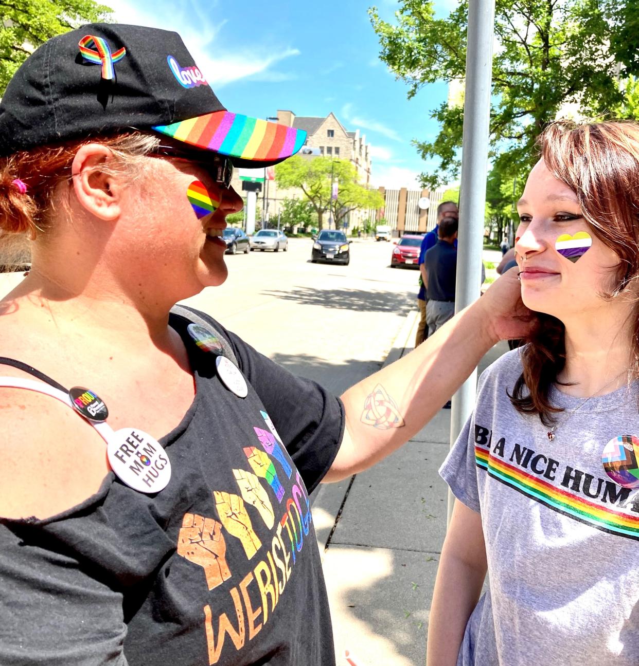 Amy DeDraske, left, at Green Bay's Pride flag-raising event on June 7, 2022, donned in all things rainbow supporting her daughter Piper, right, who identifies as a member of the LGBTQ community.