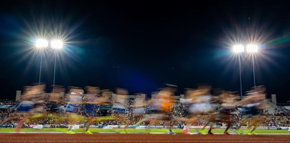 Competitors run in the 5K race at the 2023 NCAA outdoor track and field championships at Mike A. Myers Stadium in Austin, Texas.