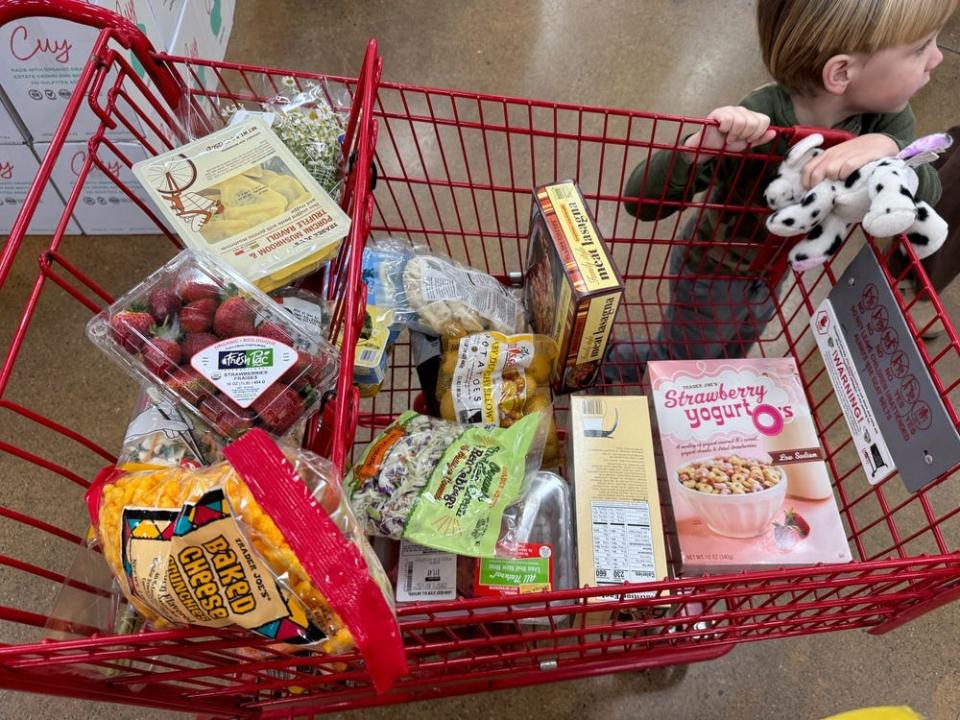 a trader joes cart with groceries