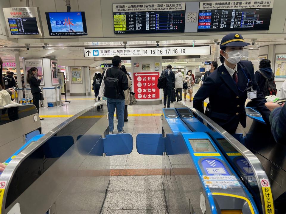 The blue ticket turnstile at the airport.