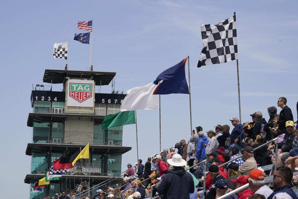 Fans watch during practice for the Indianapolis 500 auto race at Indianapolis Motor Speedway, Monday, May 23, 2022, in Indianapolis. (AP Photo/Darron Cummings)